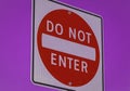 Do not enter sign on purple color background. Do not enter sign in a city Royalty Free Stock Photo