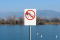 Do not feed the ducks sign near lake Royalty Free Stock Photo