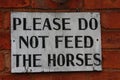 'Do not feed' sign at the stables