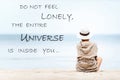 Do not feel lonely-universe inside you. Woman looking at the sea. Inspirational motivational quote. Outdoors horizontal filtered
