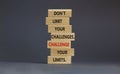 Do not limit your challenges symbol. Wooden blocks with words Do not limit your challenges. Challenge your limits. Beautiful grey