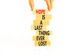 Do not lost hope symbol. Concept words Hope is a last thing ever lost on wooden blocks on a beautiful white background.