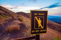 Do not pass singn written in English and Spanish on a hill in Masaya Nicaragua