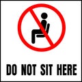 Do not sit here sign for public places to encourage social distancing Royalty Free Stock Photo