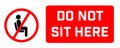 Do Not Sit Here Signage for restaurants and public places inorder to encourage people to practice social distancing to further Royalty Free Stock Photo