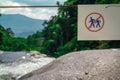 Do not walk of the trail. Warning sign in national park at waterfall in green tropical forest and mountain. Warning sign Royalty Free Stock Photo