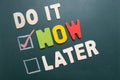 Do It Now or Later with checkbox and red check on blackboard
