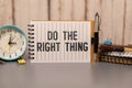 do the right thing. text on torn paper on white backing Royalty Free Stock Photo