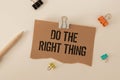 do the right thing. text on torn paper on white backing. Royalty Free Stock Photo