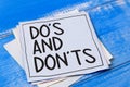 Do`s and Don`t, words quotes text typography witten on paper against wooden background, list of do and dont advice reminder