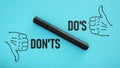 Do's and don'ts are shown using the text and thumbs up and down Royalty Free Stock Photo