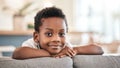 Do what makes you comfortable. Portrait of an adorable little boy relaxing on the sofa at home. Royalty Free Stock Photo