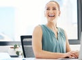 Do what makes you happy. an attractive young businesswoman sitting alone in the office and using her laptop. Royalty Free Stock Photo