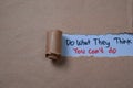 Do What They Think You Can`t Do Text written in torn paper