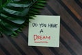 Do You Have A Dream write on sticky notes isolated on Wooden Table Royalty Free Stock Photo