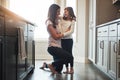 Do you know how much I love you. a happy mother hugging her cute little girl in the kitchen at home. Royalty Free Stock Photo