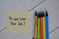 Do you Like Your Job write on sticky notes isolated on Wooden Table