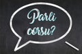 Do you speak Corsican written on a blackboard Royalty Free Stock Photo