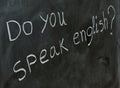 Do you speak English, written on a blackboard Royalty Free Stock Photo