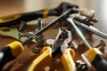 Do It Yourself DIY accessories - locksmith tools, wrenches, screwdrivers, pliers, nuts and bolts on a wooden table Royalty Free Stock Photo