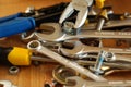 Do It Yourself DIY accessories - locksmith tools, wrenches, screwdrivers, pliers, nuts and bolts on a wooden table Royalty Free Stock Photo
