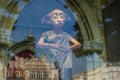 Dobby of reflection in window of Polonia Wax Museum at Main Market Square.