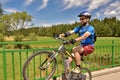 Young man trying a wheelie with his bike