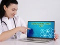 DOBUTAMINE STRESS TEST text in search bar. Nurse looking for something at laptop