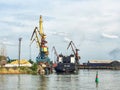 Dock cranes in a small sea port