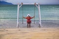 Doc Let beach, Swing with rope on the beach. Swings on the beach. Swing hanging on the beach side Royalty Free Stock Photo