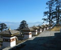 The 108 chortens stupas is the memorial in honour of the Bhutanese soldiers with mountain background at Dochula Pass on the road Royalty Free Stock Photo