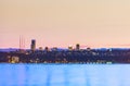 Dock with background of Bellevue cityscape with reflection on lake washington at night