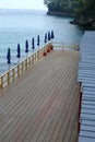 Dock, Blue Umbrellas Await the Italian Summer Sun