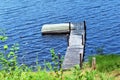 Dock and boat on Leonard Pond, Colton, St. Lawrence County, New York, United States. NY. US. USA.