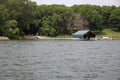 A Dock and a Boat Shelter on a Lake