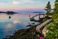 Dock And Boats In Bay In Boothbay, Maine, At Sunrise In Summer In Soft Beautiful Light On Reflective Water