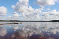 Dock and cloud reflection at a lake in Ranua, Finland Royalty Free Stock Photo