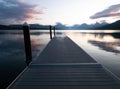 Dock Jutting into Lake McDonald in Glacier National Park, Montana, at Dawn Royalty Free Stock Photo