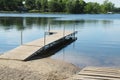 The dock on the lake is for small boats. Royalty Free Stock Photo