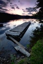 Dock on lake at sunset. Royalty Free Stock Photo