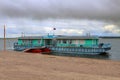 Dock or landing stage on the Yenisei River, dramatic clouds Royalty Free Stock Photo