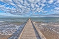 A dock leads to the mediterranean sea at the beach of Lido die Jesolo