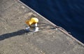 Dock at the lock for the addition of river cargo ships. metal bollards for mooring steel ropes on the navigation channel. waterfro Royalty Free Stock Photo