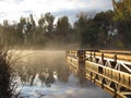 Dock on misty foggy lake Royalty Free Stock Photo