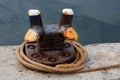 Old Dock Mooring Cleat and Rope at a Harbour Location Royalty Free Stock Photo