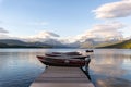 Dock over of lake Mcdonald surrounded by mountains Royalty Free Stock Photo