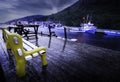 Dock scene overlooking fishing boats and fish cleaning stations