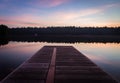 A dock view of on Lake Joseph at dawn. Royalty Free Stock Photo