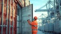 A dock worker carefully loads a large refrigerated container onto a ship careful not to damage the delicate perishable