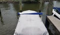 Docked boat with cover on